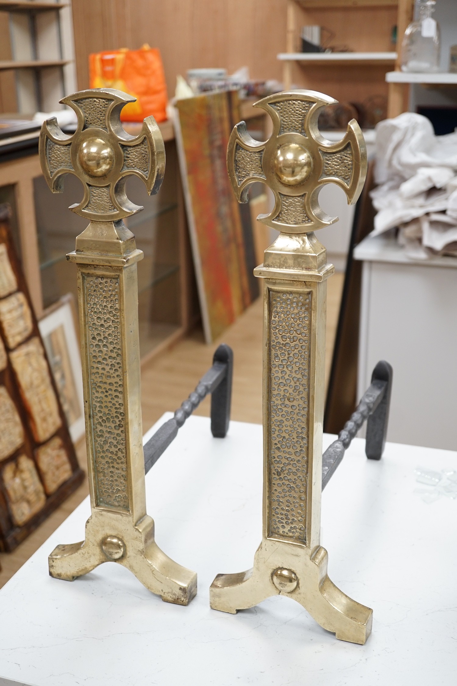 A pair of 18th century style brass and cast iron fire dogs, 54cms high